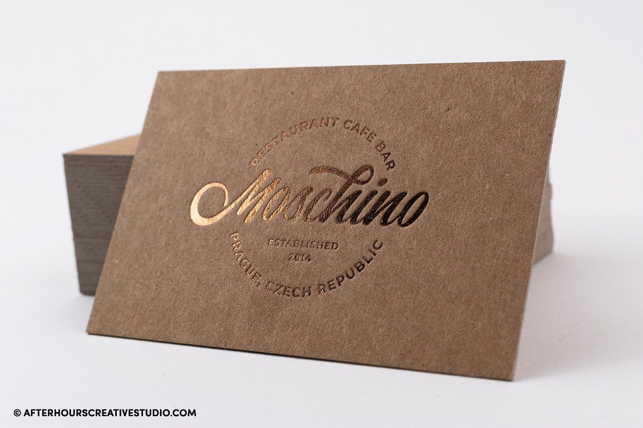 Kraft business card with metallic brown foil stamping.