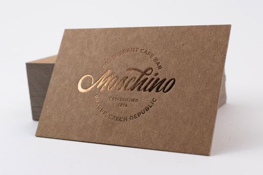 Kraft business card with metallic brown foil stamping.
