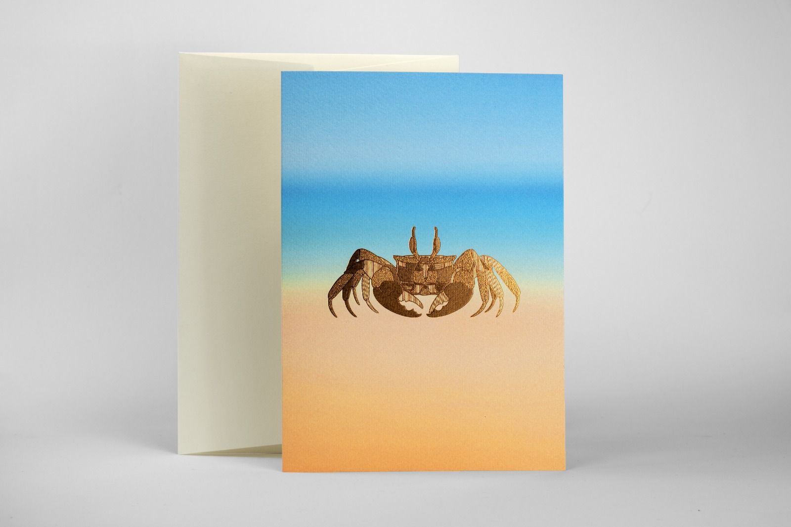 Bronze foil stamped crab note card on recycled textured stock 350gsm with ivory envelope.