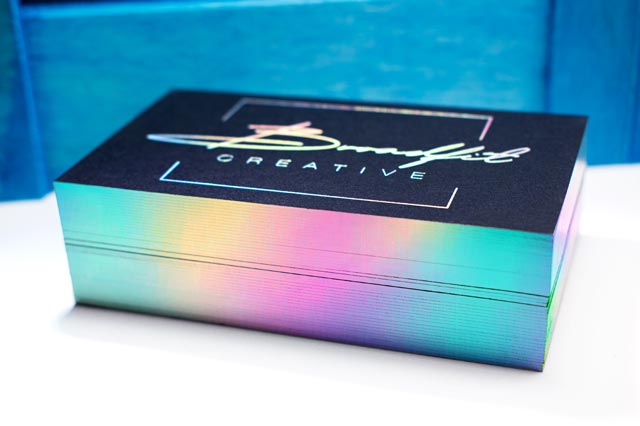 Black business card with holographic edge gilding and foil stamping